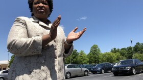 Stacey Abrams gives her supporters a pep talk at an early vote rally in DeKalb County, Ga.