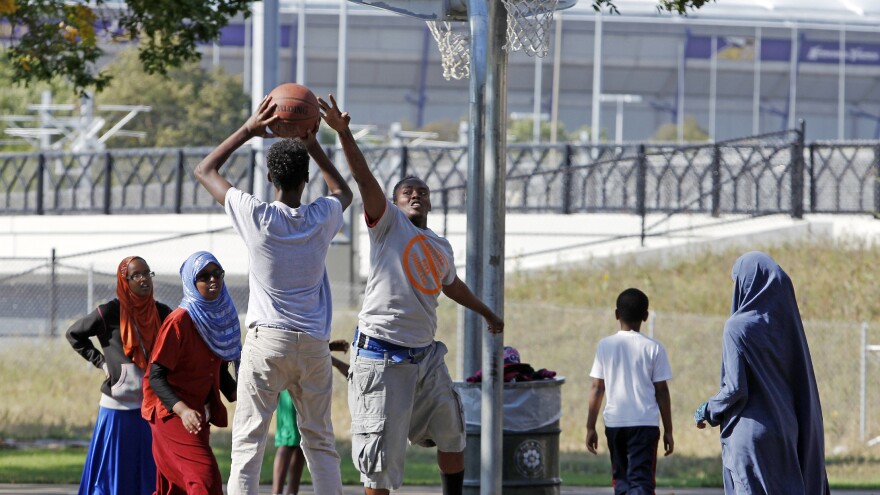 Somali-American youths play basketball before the start of a September 2013 solidarity rally by the Minneapolis Somali community to denounce al-Shabab's attack of a shopping mall in Nairobi, Kenya. Less than a decade after groups of teens from Minneapolis emigrated to Somalia to join the terrorist group, more have been recruited to join the self-declared Islamic State in Syria.