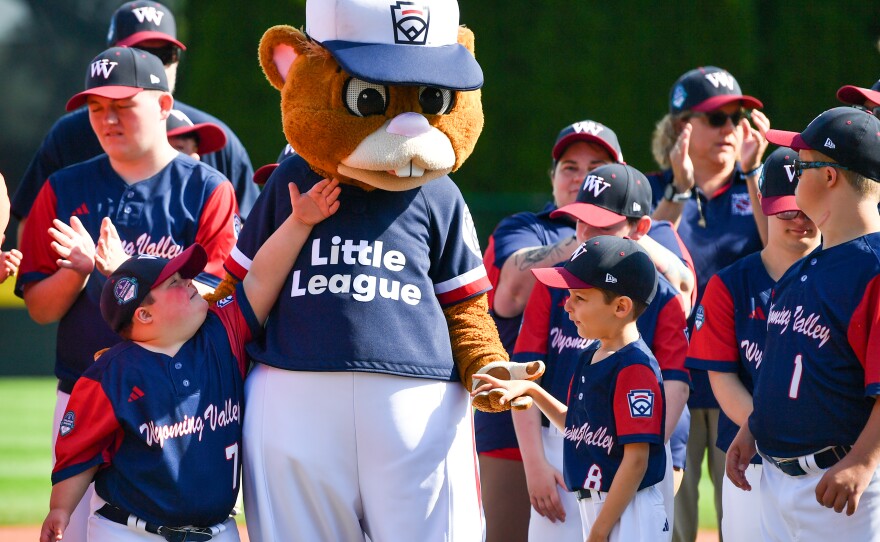 Members of the Wyoming Valley Challenger team meet Dugout, the mascot of the Little League World Series.