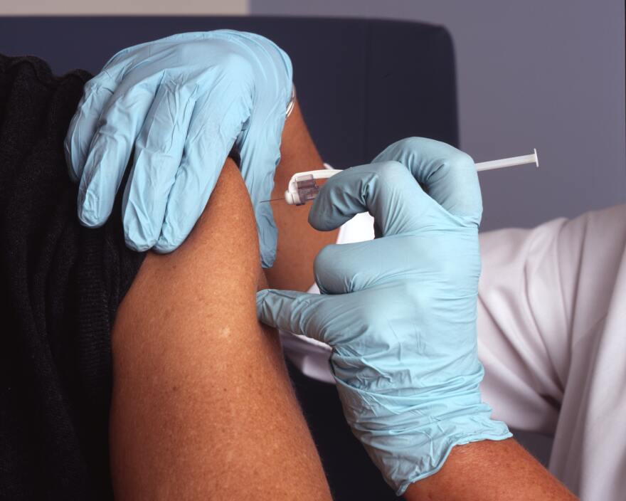 Nurse administers a vaccine.