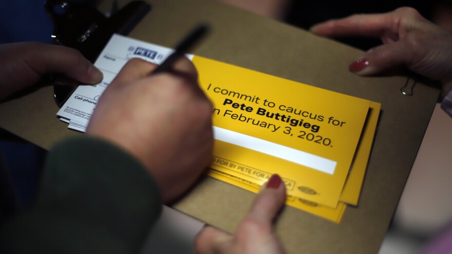 A person signs up to caucus for Democratic presidential candidate and former South Bend, Ind., Mayor Pete Buttigieg following a town hall meeting in Fort Dodge, Iowa.