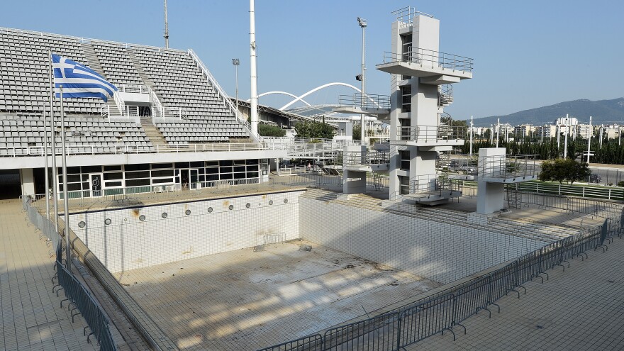 The Olympic Aquatic Center in Athens sits vacant since the 2004 Summer Olympics. Greece's economic frailties post-Olympic Games have prevented any further investment, and the majority of the newly constructed stadiums now lie abandoned.