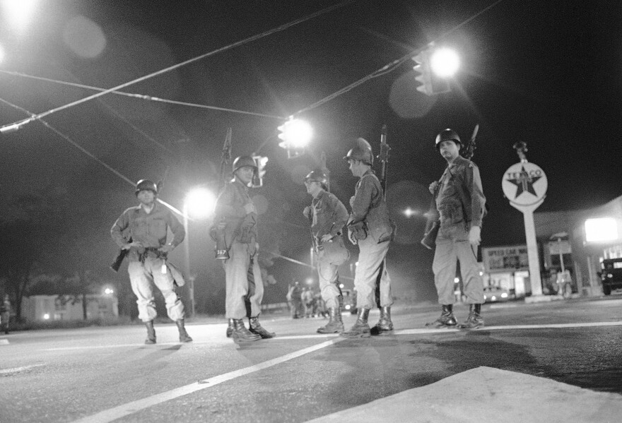 Georgia National Guard troops stand at an intersection at the edge of the riot-torn area of town in Augusta, Ga., on May 12, 1970. More than 100 blocks of neighborhoods and businesses — about 7 miles — were ransacked and vandalized. Police killed six Black men.