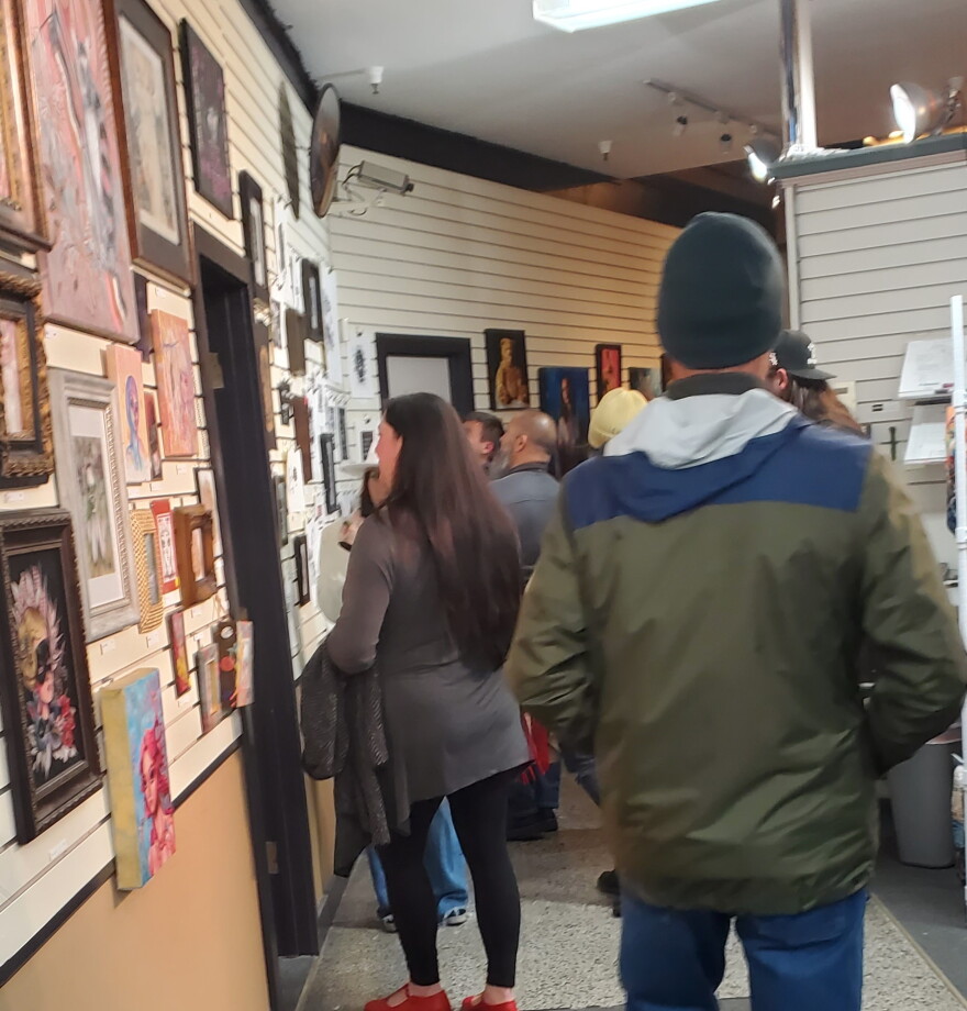 Spectators checking out art at Bennie's cleaners in Rockford.