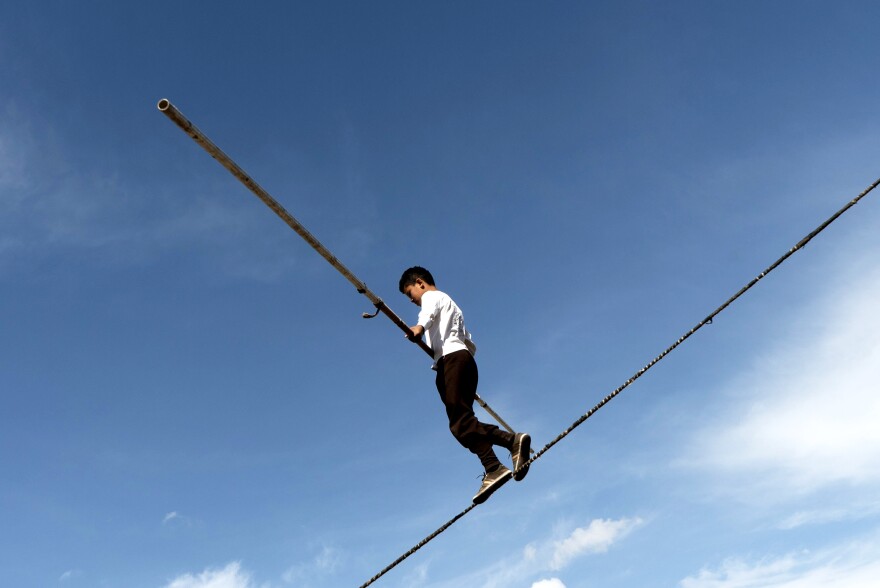 A Turkish tightrope walker shows his skills at the games.