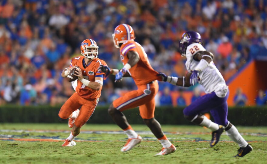 Florida quarterback Will Grier (7) runs as he looks for an open receiver downfield.