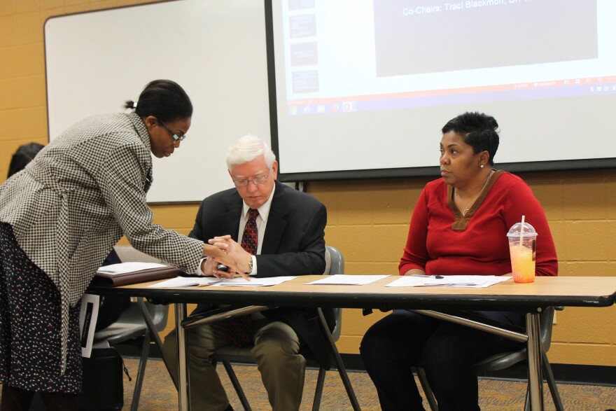 Ferguson Commissioners T.R. Carr and Traci Blackmon wait to start a meeting of the commission's municipal governance working group.