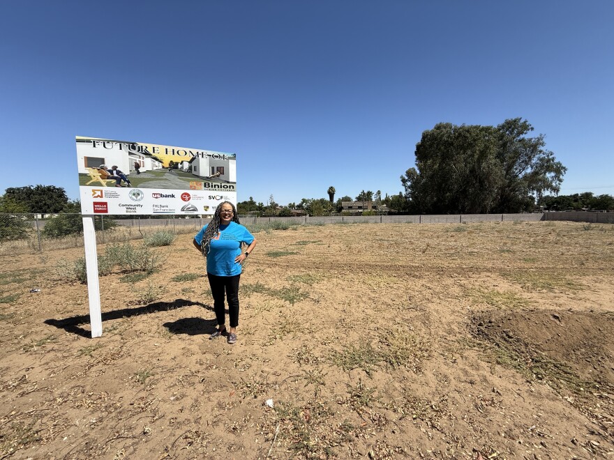 Allysunn Walker stands on currently empty land that belongs to the West Side Church of God in Fresno, Calif. The site will eventually house seniors on fixed incomes.