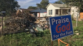 Debris fills the front yard of a Sonora home, more than a month after flooding surprised town's residents. 