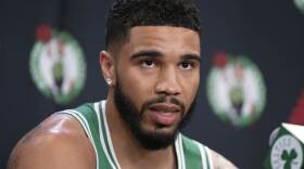 Boston Celtics' Jayson Tatum speaks at a news conference during the NBA basketball team's media day, Tuesday, Sept. 24, 2024, in Boston. (AP Photo/Michael Dwyer)