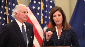South Carolina Gov. Henry McMaster, left, listens as Lt. Gov. Pamela Evette, right, speaks at a news conference on Monday, Jan. 12, 2026, in Columbia, S.C. (AP Photo/Jeffrey Collins)