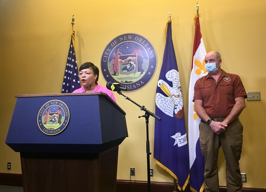 Mayor LaToya Cantrell, left, and Homeland Security and Emergency Preparedness Director Colin Arnold, right, urged residents to keep paying attention to the weather, even as the forecast improved Friday.