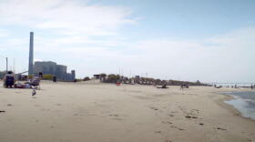 Kids play at the beach at Washington Park not too far from the NIPSCO coal plant.