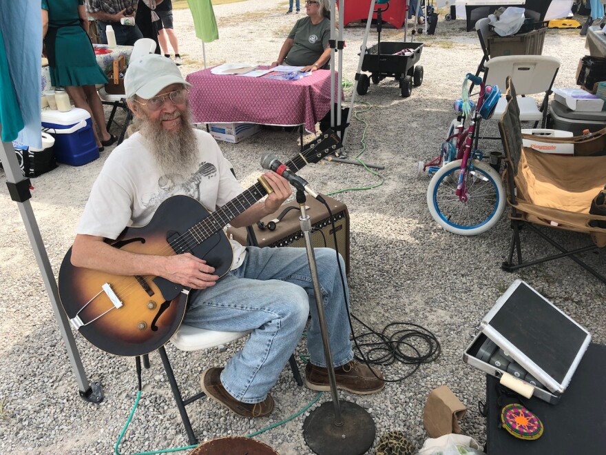 Eureka resident, Jerry Jones entertains market patrons as they wander through.