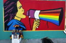 A mural of Dolores Huerta is painted outside a Bakersfield meat market.