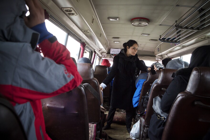 Nargis Azaryun briefs the young women in the bus heading to a weekly practice ascent on the outskirts of Kabul.