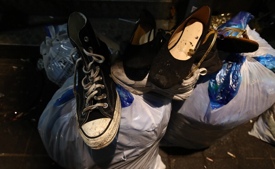 The belongings of victims are seen at the scene of the deadly stampede. (Photo by Chung Sung-Jun/Getty Images)