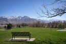 A park bench warms in the sun at Salt Lake City's Sugar House Park, March 19, 2026.