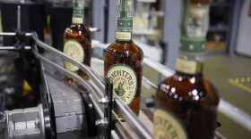 Bottles of Michter's Rye move down a conveyor belt at Michter's Shively Distillery in Louisville, Ky. (Luke Sharrett for Here & Now)