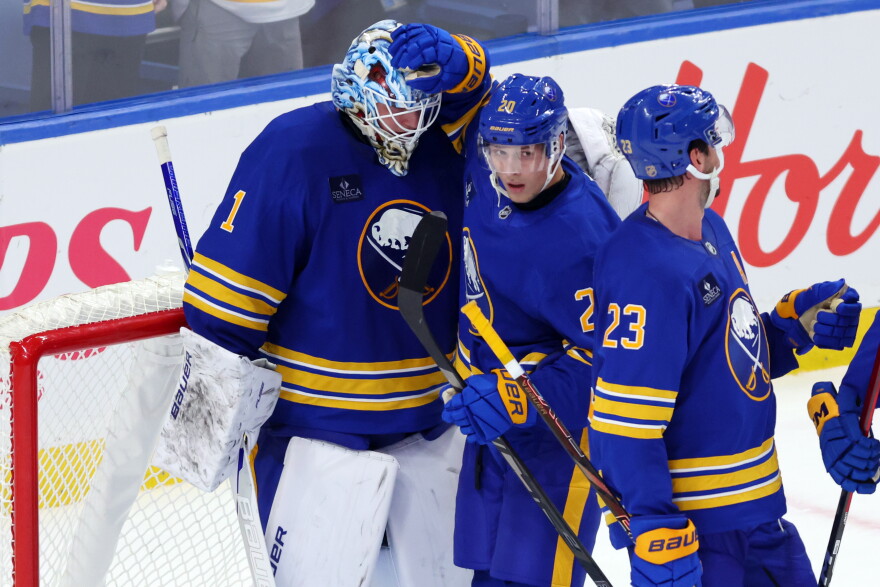 Buffalo Sabres goaltender Ukko-Pekka Luukkonen (1) and center Jiri Kulich (20) celebrate victory following the third period of an NHL hockey game against the Chicago Blackhawks Saturday, Oct. 3, 2026, in Buffalo, N.Y. (AP Photo/Jeffrey T. Barnes)