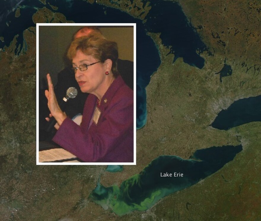 Rep. Marcy Kaptur with satellite map of Lake Erie with algae growth (Brian Bull/NASA Goddard Space Flight Ctr)