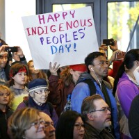People look on at a celebration of Indigenous Peoples' Day in 2016 at Seattle's City Hall. Seattle began observing Indigenous Peoples' Day two years earlier to promote the well-being and growth of Seattle's Indigenous community.