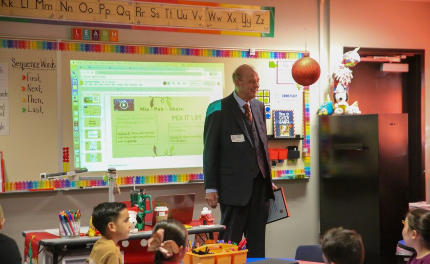 Horne speaks with Chellie Gordon's first grade class. Just before he left, they pointed out the Elf on the Shelf behind him.