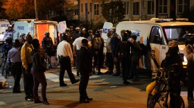 Philadelphia police issue a final warning for curfew violation to protesters at 55th and Pine Streets in West Philadelphia, on Wednesday, the third straight night of protesting and unrest after the fatal shooting of Walter Wallace Jr. by police.