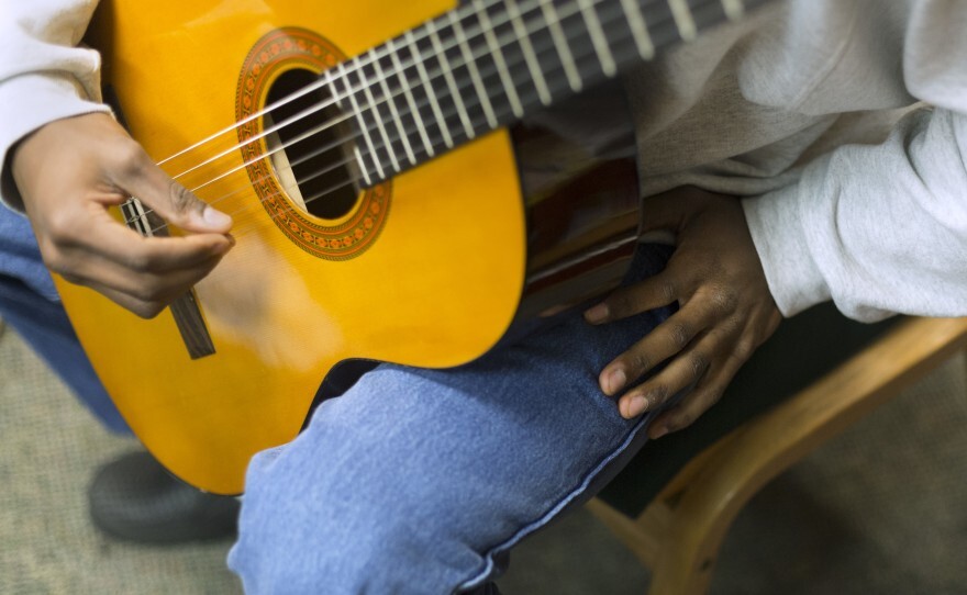 Demetrius Hardison practices classical guitar at Gardner Betts Juvenile Detention Center.