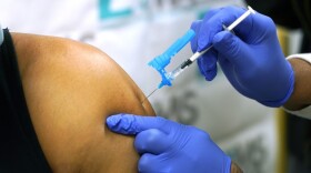 A vaccine shot being given