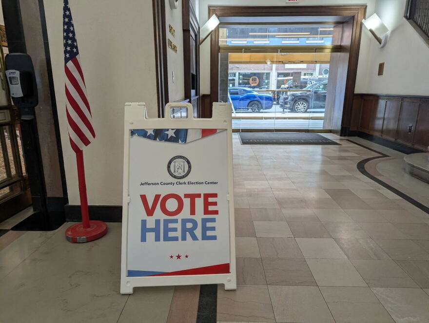 A "Vote Here" sign at an early voting location