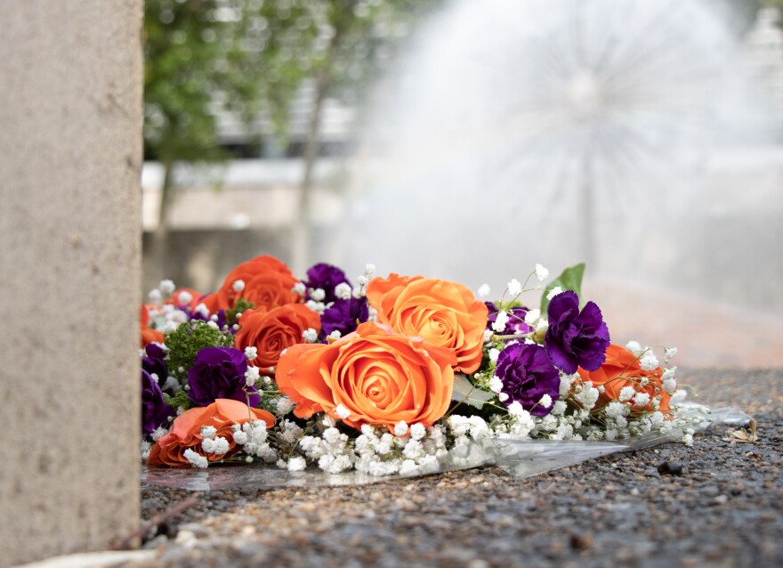 A bouquet of flowers left at the Memorial Fountain.