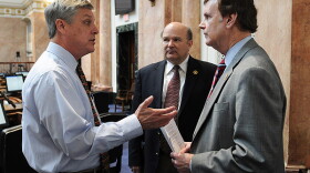 House Budget Committee Chair Rick Rand, D-Bedford (left), confers with House Majority Whip Tommy Thompson, D-Owensboro (right), and House Majority Caucus Chair Robert Damron, D-Nicholasville, prior to the start of the day's legislative session in the Kent