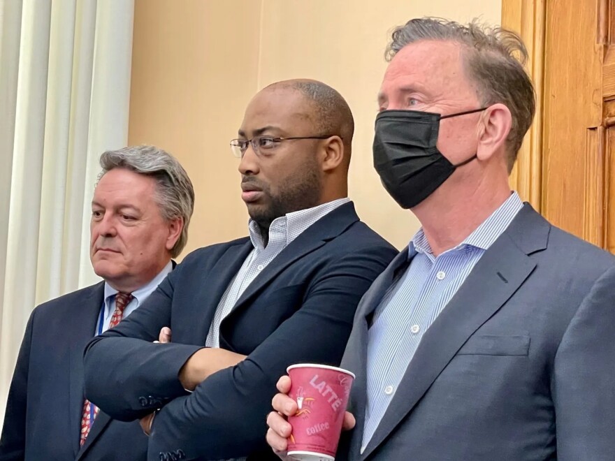 Jeffrey Beckham, Secretary of the Office of Policy and Management; Chief of Staff Paul Mounds; and Gov. Ned Lamont at the announcement of a budget deal on April 27, 2022. MARK PAZNIOKAS