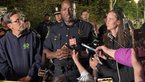 Seattle Police Assistant Chief Tyrone Davis speaks at a press conference with Gov. Bob Ferguson, left, and Seattle Mayor Katie Wilson, right, following a shooting at Seattle Center Sunday, July 26, 2026.