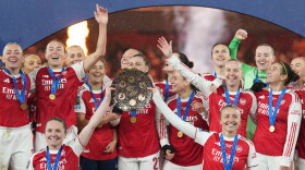 FILE - Arsenal's team captains Kin Little, left, and Leah Williamson, right, lift the trophy after winning the Women's Champions Cup final soccer match between Arsenal FC and SC Corinthians in London, Sunday, Feb. 1, 2026.