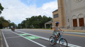 Mayor Grover C. Robinson, IV test out new bike lanes with Rand Hicks, Robbie Mott, Heidy Miner and Christian Wagley in 2019.