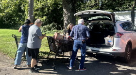 Volunteers unload groceries outside the Eastern Area Community Ministries in Louisville at the start of the city-wide food drive.