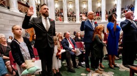 Sen. Nick Shroer, R-O’Fallon, takes the oath of office alongside his daughters on Wednesday, Jan. 4, 2023, during the first day of the legislative session at the Missouri State Capitol in Jefferson City. Senators Travis Fitzwater, R-Calloway County, Karla May, D-St. Louis, and Mike Bernskoetter, R-Jefferson City, are to Shroer's right.