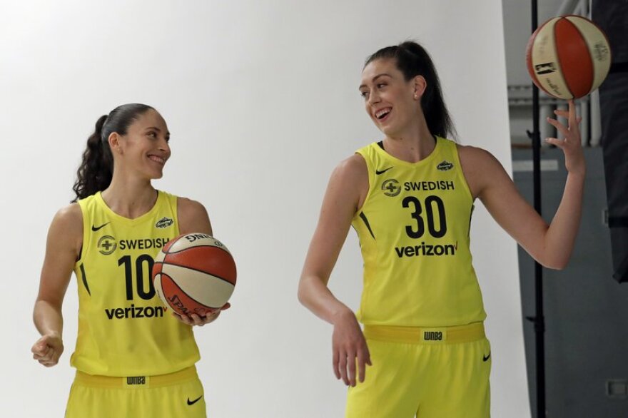 WNBA players Sue Bird and Breanna Stewart pose during a photo session during the Seattle Storm's media day.