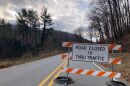 A sign declares the closure of U.S. 176 in Polk County.