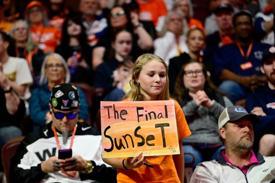A fan holds a sign in the first half of the Connecticut Sun and Toronto Tempo game.