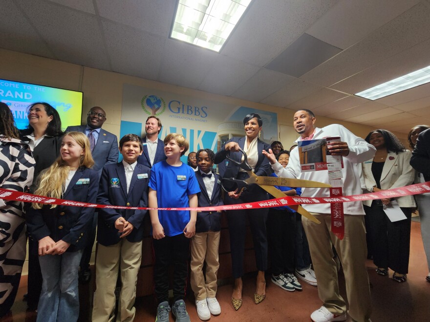 Gibbs elementary principal Tina Greenwood celebrates the opening of new First Security Mock Bank