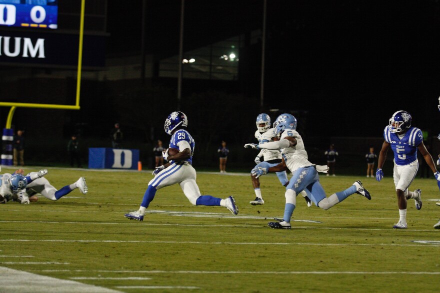 Shaun Wilson escapes defenders for a 13 yard gain in the second quarter.