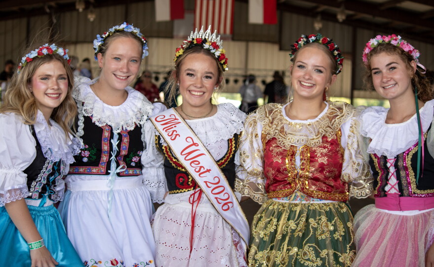 Members of West's Junior Historians, including Miss West 2026 Karen Fuessel at center, pose for a photo before their performance at the 50th anniversary of Westfest on Saturday. The performers wear kroj, a traditional Czech costume.