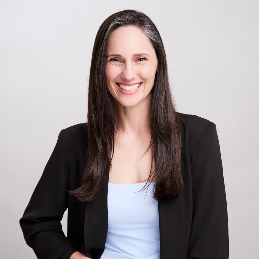 A headshot of a woman