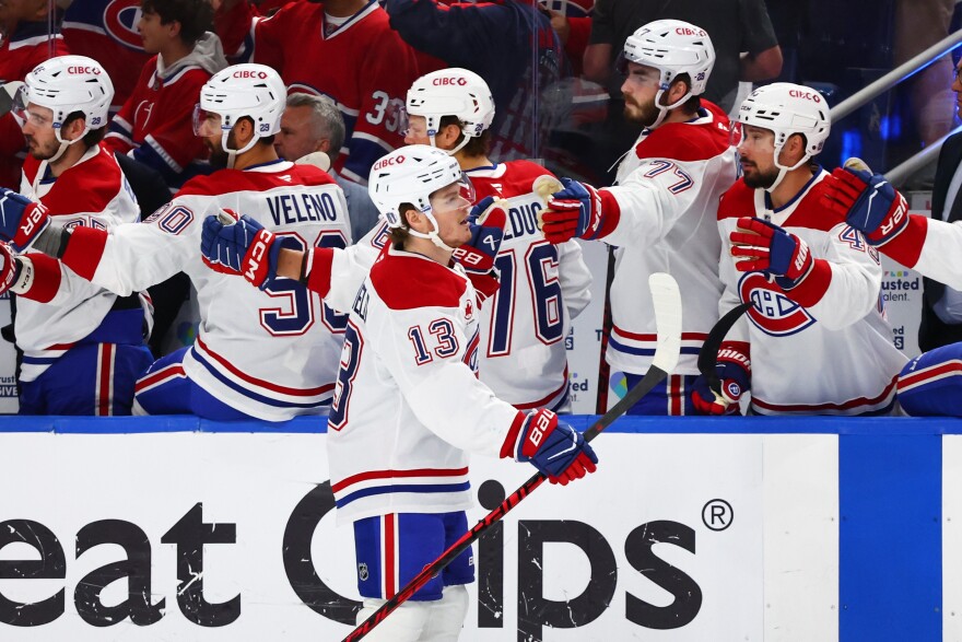 Montreal Canadiens right wing Cole Caufield (13) celebrates his goal during the first period in Game 5 of a second-round NHL hockey Stanley Cup playoff series against the Buffalo Sabres, Thursday, May 14, 2026, in Buffalo, N.Y. (AP Photo/Jeffrey T. Barnes)
