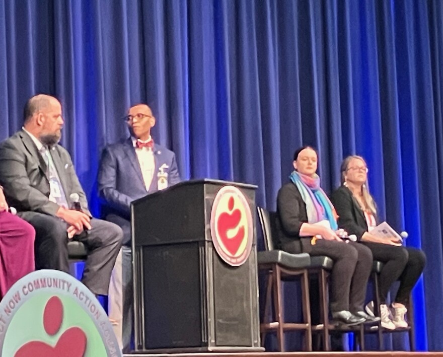 The Third Place QC co-founder Christie Adamson (second from right) listens during Thursday's panel discussion on homelessness.