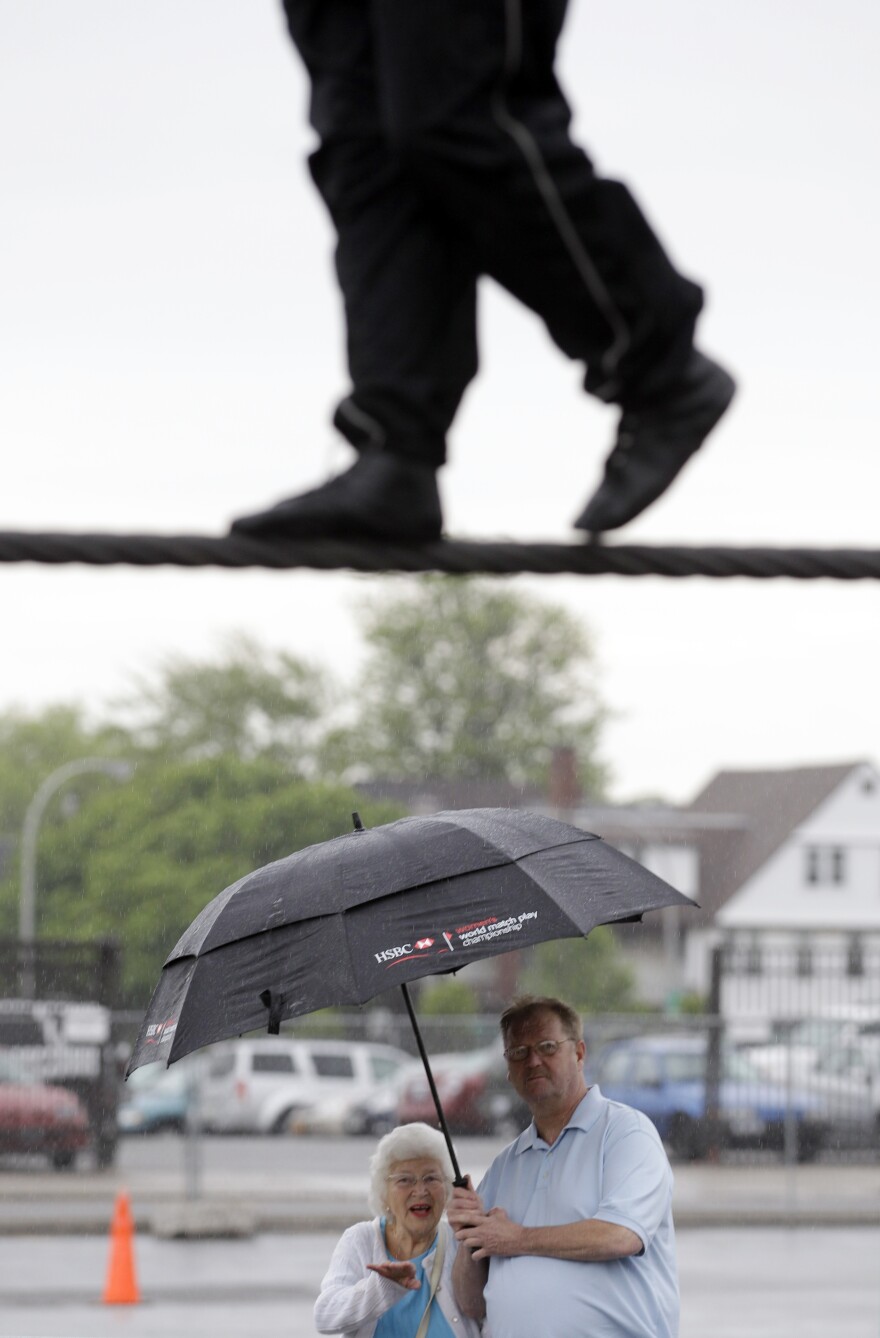 Spectators watch Nik Wallenda practice in Niagara Falls, N.Y. Local officials are hoping the stunt revives flagging tourism.