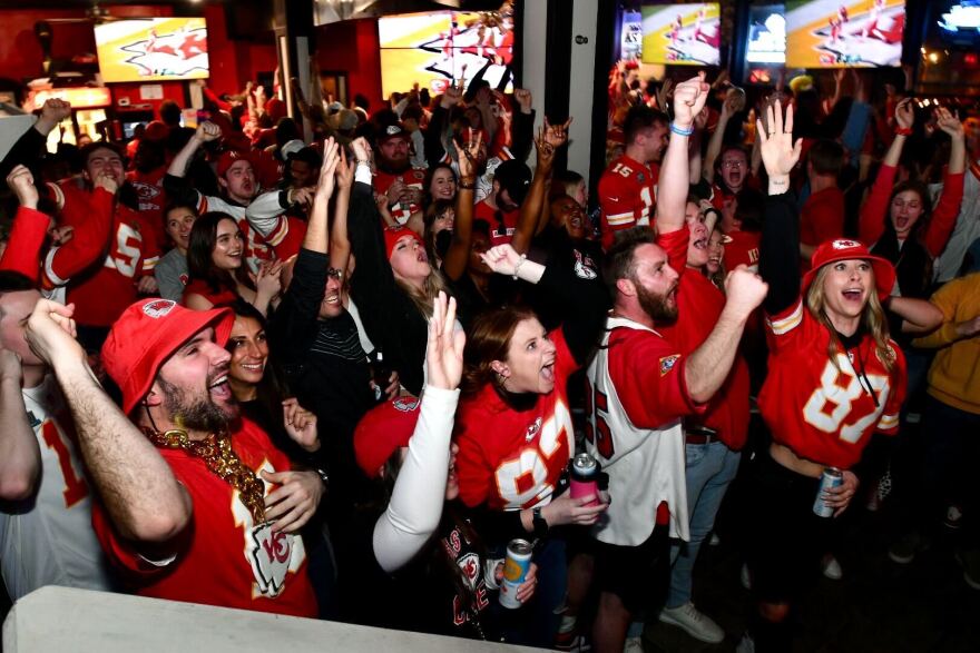 Kansas City Chiefs fans at John's Big Deck in Kansas City react when Nick Bolton caught a loose ball and ran it back for a touchdown in Super Bowl LVII on Feb. 12, 2022.
 
